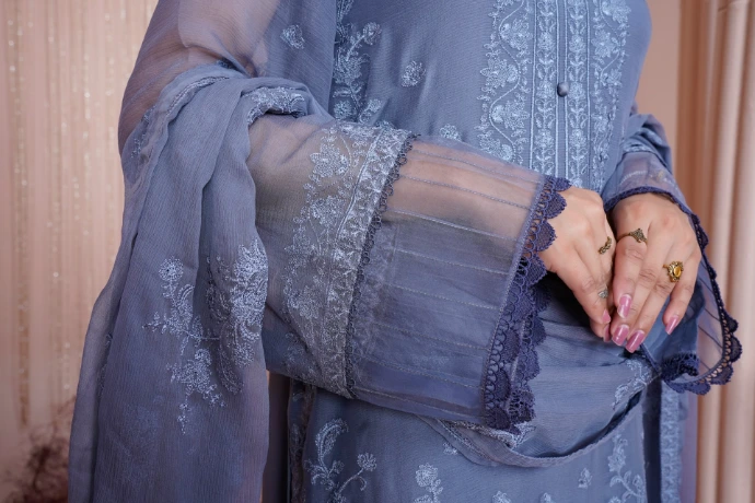 a close up of a person holding a purse